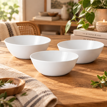 تحميل الصورة في عارض المعرض، Three white ceramic bowls of different sizes arranged on a clean white background.

