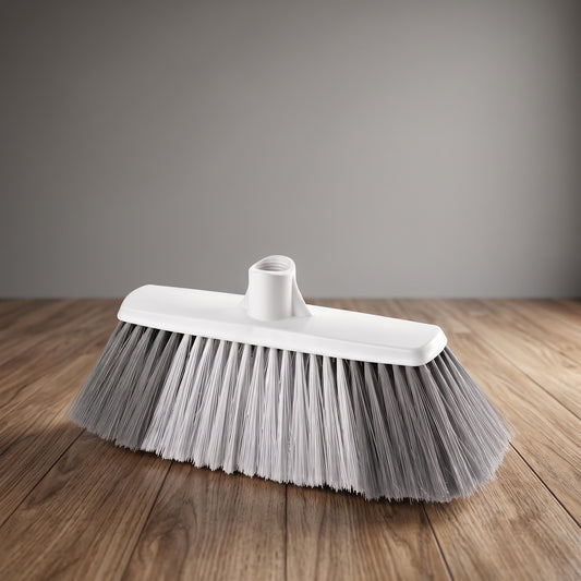 Soft-bristle broom head with gray and white bristles on a wooden floor
