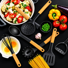 Load image into Gallery viewer, Set of kitchen utensils including spatulas and a whisk on a black surface with vegetables.
