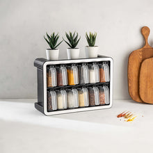 Load image into Gallery viewer, Black spice rack with twelve clear jars on a kitchen countertop
