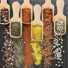 Load image into Gallery viewer, Six wooden measuring scoops filled with various whole and ground spices, arranged on a dark slate background with additional loose spices spilled around them.
