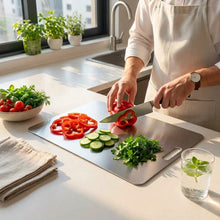 تحميل الصورة في عارض المعرض، Stainless steel cutting board on a kitchen counter with 'El Khlouf' branding.
