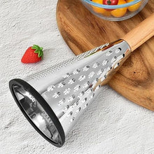 Load image into Gallery viewer, Cone grater resting beside a board and strawberry
