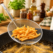Load image into Gallery viewer, Stainless steel wire strainer with cooked french fries over a frying pan in a kitchen setting.

