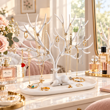 Load image into Gallery viewer, White deer-shaped jewelry organizer stand with necklaces, earrings, and rings for stylish vanity decor.
