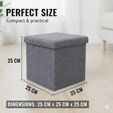Load image into Gallery viewer, Gray storage ottoman with dimensions labeled on a light wooden floor.

