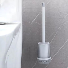 تحميل الصورة في عارض المعرض، White toilet brush with holder against a gray tiled bathroom wall.
