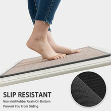 تحميل الصورة في عارض المعرض، Person stepping onto a slip-resistant mat with text highlighting its non-skid feature.
