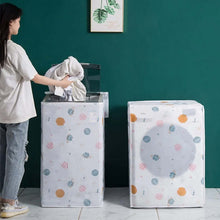 Load image into Gallery viewer, Woman putting clothes into a laundry basket with a polka dot design against a teal wall.
