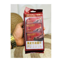تحميل الصورة في عارض المعرض، Hand holding a package of leather care wipes with a blurred background
