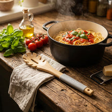 Load image into Gallery viewer, Wooden spoon with a gray handle on a black textured surface

