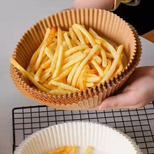 Load image into Gallery viewer, Disposable non-stick air fryer paper liners with French fries for easy cleanup
