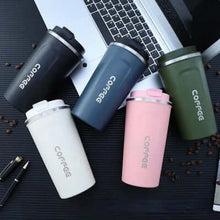 Load image into Gallery viewer, Variety of stainless steel airtight cups in different colors, placed near a laptop and coffee beans.
