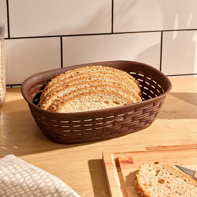 Storage basket with sliced bread on a kitchen countertop, showcasing a multifunctional design in brown.