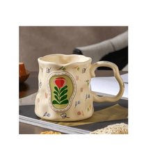 Load image into Gallery viewer, Colorful floral porcelain mug with a unique shape, perfect for serving coffee or tea on a stylish table.
