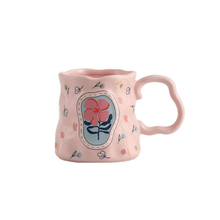 Load image into Gallery viewer, Colorful floral porcelain mug with pink exterior and artistic flower design, ideal for coffee or tea.
