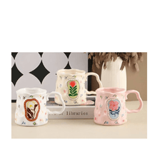 Load image into Gallery viewer, Three colorful porcelain mugs with floral designs on a table, perfect for coffee or tea.
