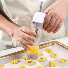 Load image into Gallery viewer, Cookie Press Gun Kit Set Stainless Steel Spritz Cookie Maker Machine for DIY Baking with 13 Discs and 6 Icing Decorating Nozzles for DIY Biscuit Maker and Decoration in use.
