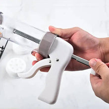 Load image into Gallery viewer, Cookie Press Gun Kit Set Stainless Steel Spritz Cookie Maker Machine for DIY Baking with 13 Discs and 6 Icing Decorating Nozzles for DIY Biscuit Maker and Decoration in use.
