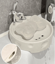 تحميل الصورة في عارض المعرض، Porcelain soap holder with rabbit design, featuring drainage for soap. Elegant and modern for bathroom or kitchen use.
