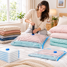 Load image into Gallery viewer, Vacuum storage bags beside folded bedding

