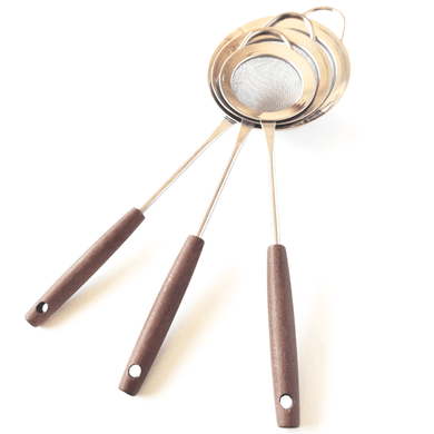 A set of three stainless steel fine mesh round strainers with wooden handles, displayed with the strainers in an upright position and the handles in a curved state.