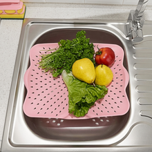 Load image into Gallery viewer, Pink flat colander with fruit and vegetables over a sink
