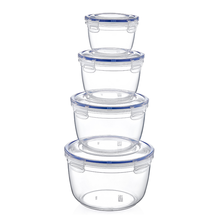 A set of four clear round food storage containers with blue lids, stacked in order of size.