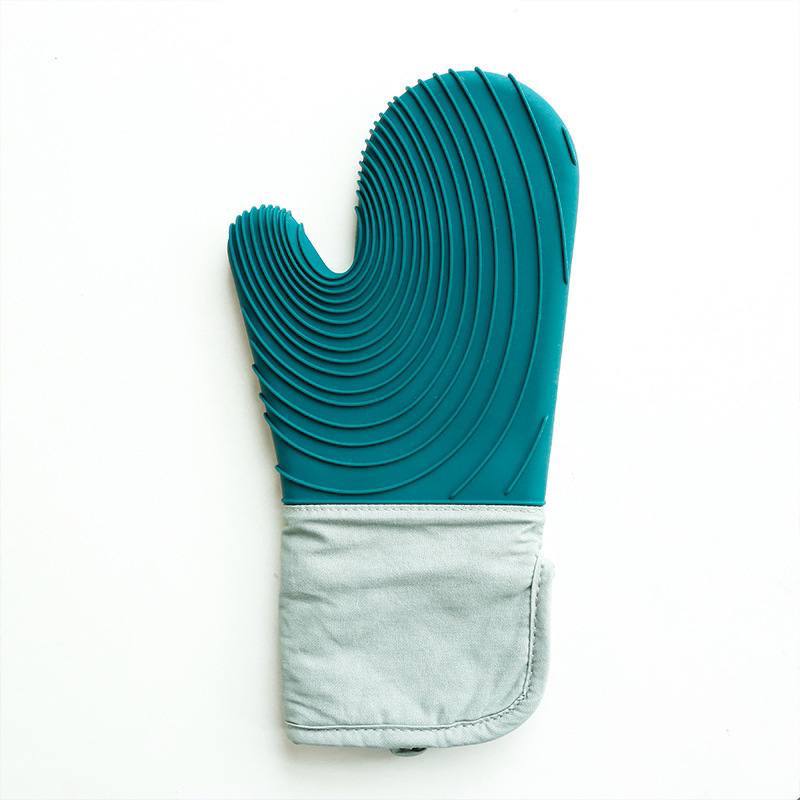 A single green silicone grilling glove with a quilted cotton lining visible at the wrist.