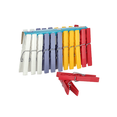 A set of multicolored plastic clothespins, including white, blue, yellow, and red colors, displayed on a green background.