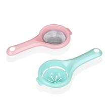 Load image into Gallery viewer, Two kitchen tools, one pink tea strainer and one green plastic egg separator, isolated on a white background.
